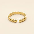 Bague ajustable Nina dorée — vue de face, pois ronds
