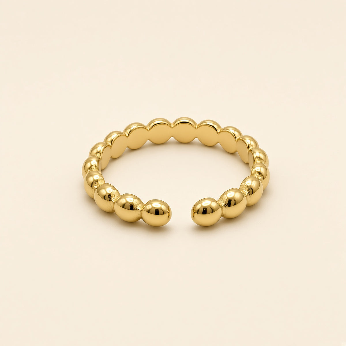 Bague ajustable Nina dorée — vue de face, pois ronds